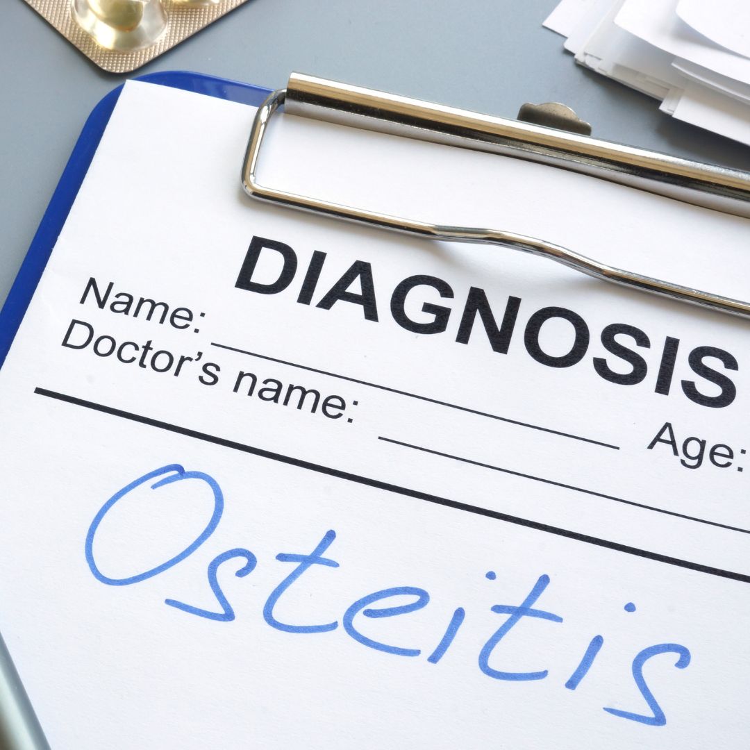 A clinical diagnosis form on a clipboard with osteitis written in the diagnosis field