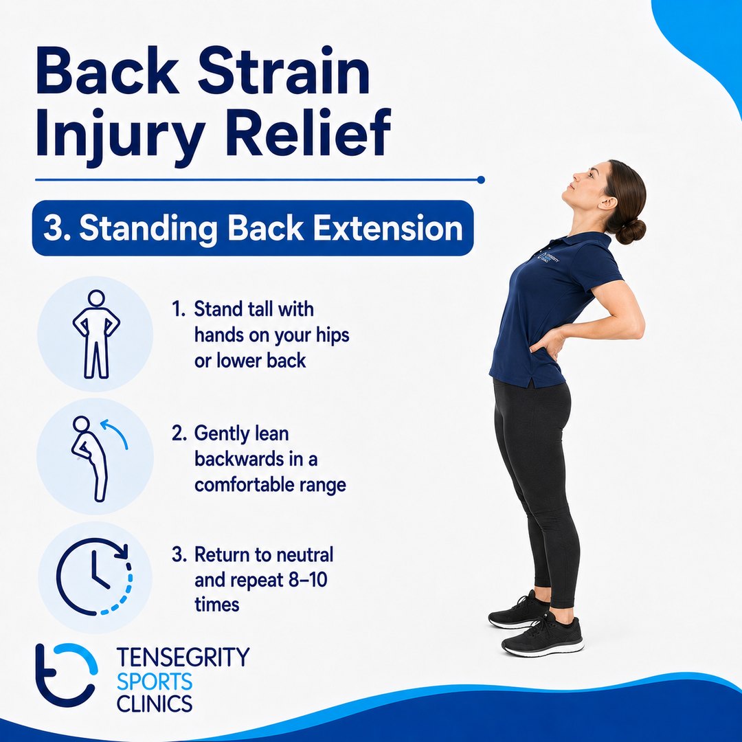 Standing back extension for back strain, standing tall with hands on the hips and leaning gently backwards
