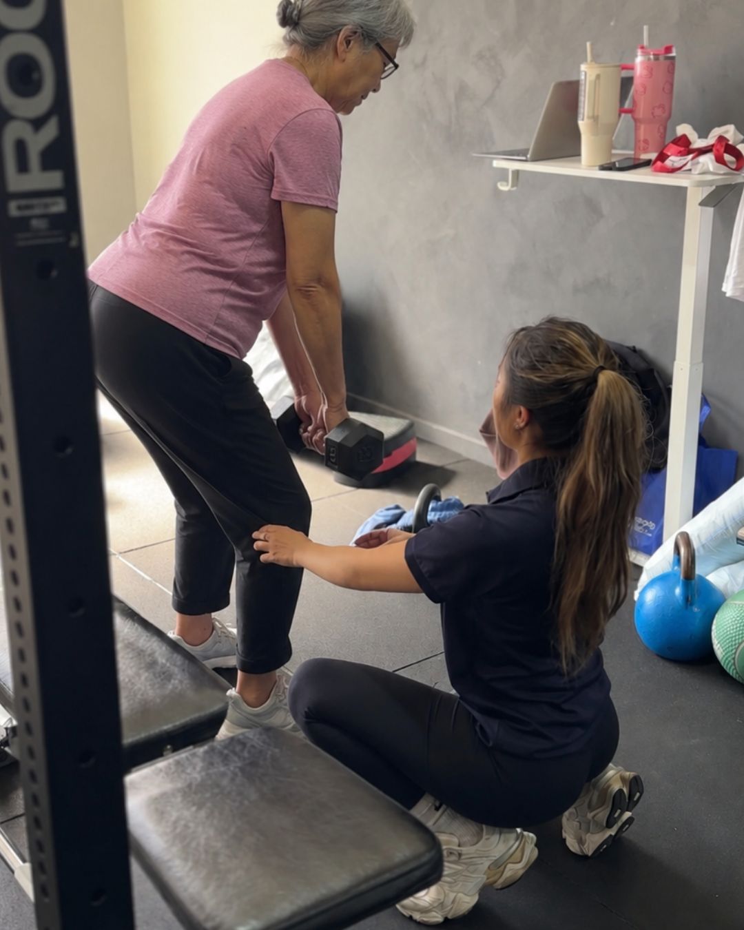 Physiotherapist coaching a patient through a step-up exercise at Tensegrity Clinics St Leonards
